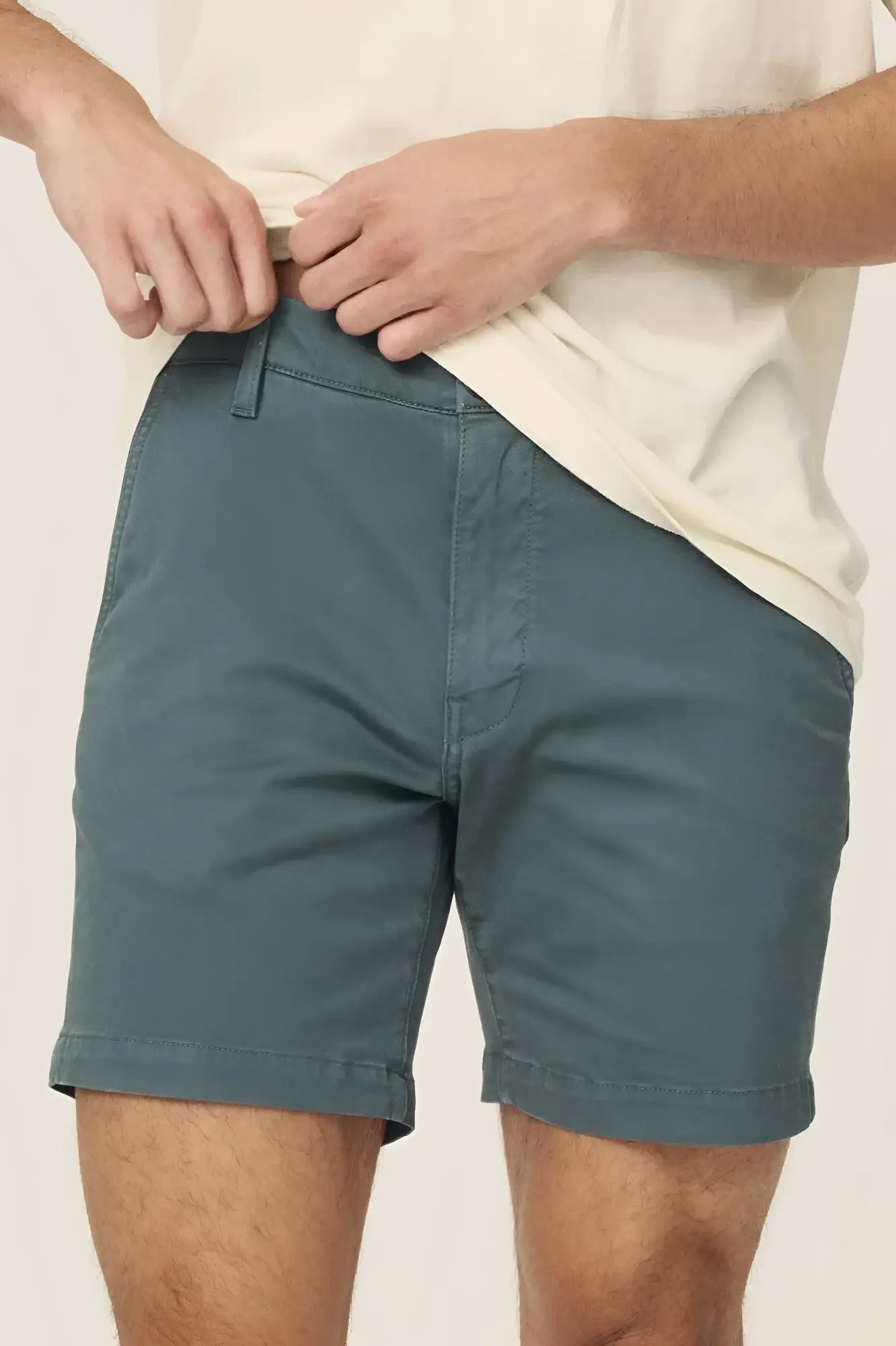 Men’s teal act chino shorts with classic fit rolled cuffs made from breathable cotton fabric for casual wear
