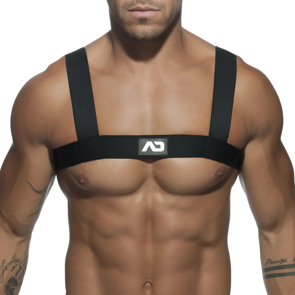 Black ad basic harness chest strap with adjustable shoulder straps and central logo patch for secure fit