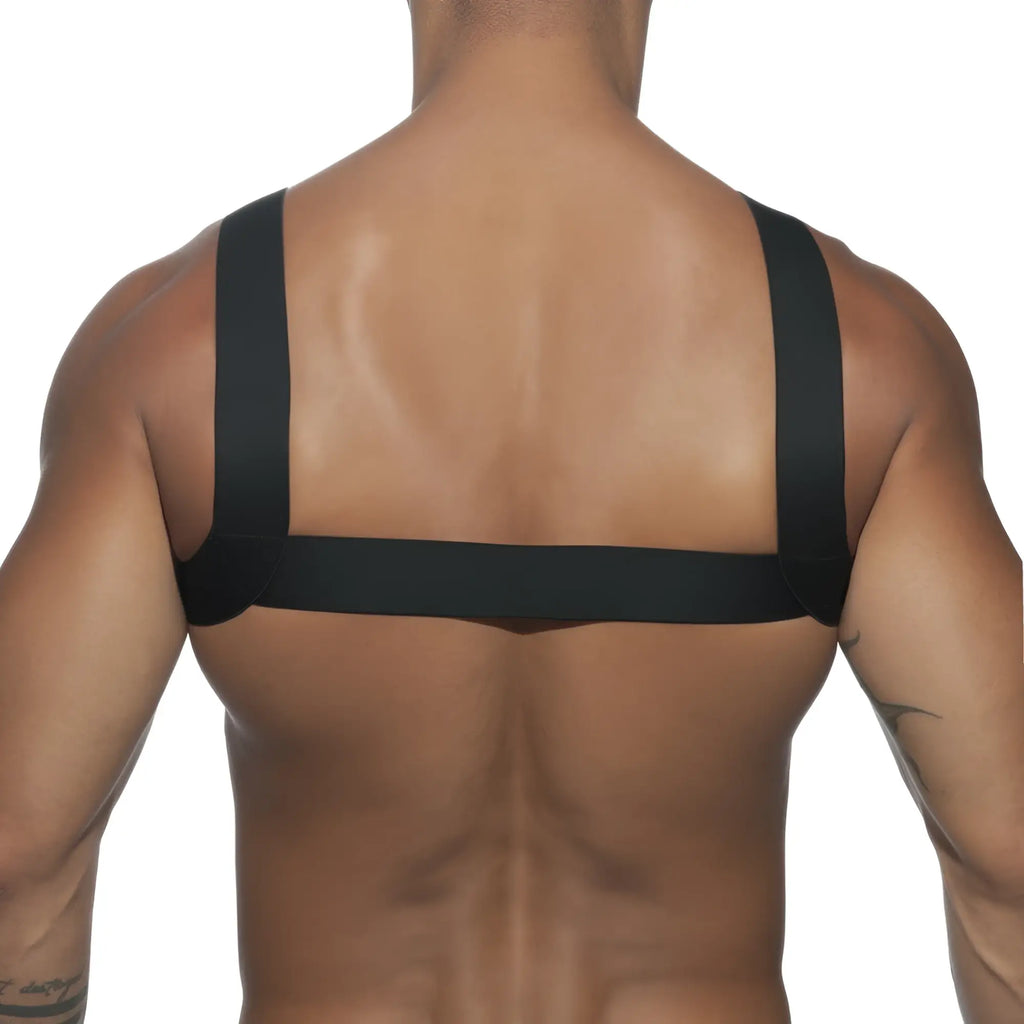 Back side of ad basic harness showing black elastic strap harness worn across the back for support and style