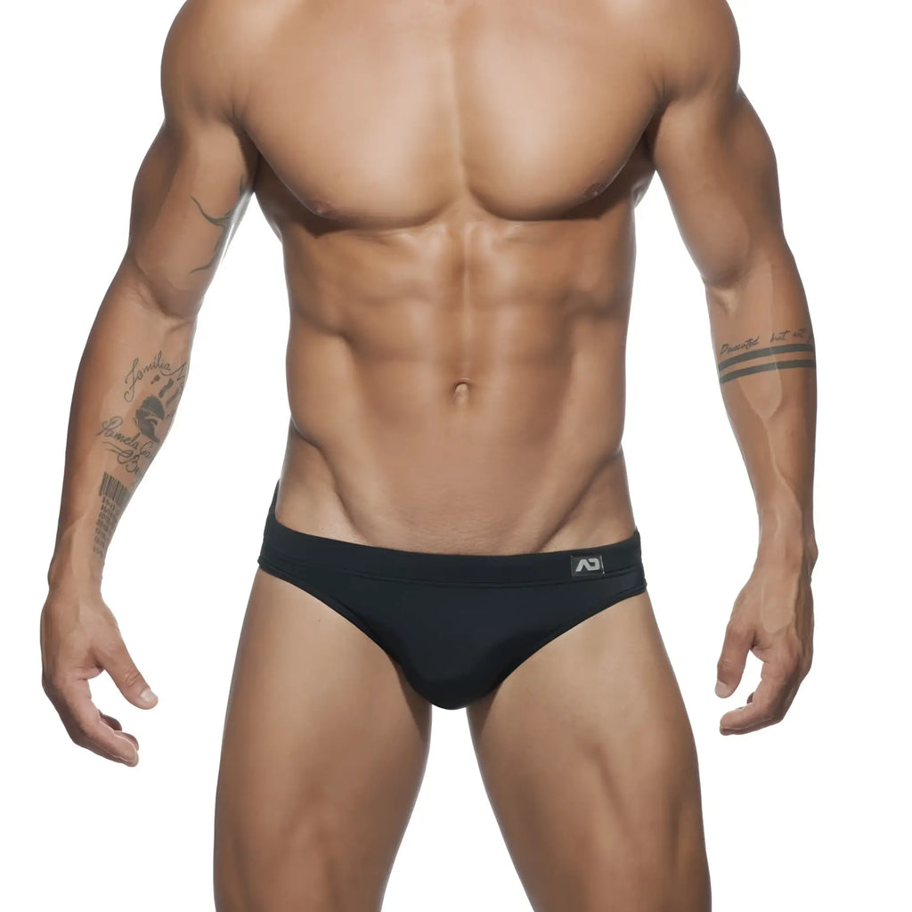 Black ad basic swim brief with subtle logo on waistband made from durable swim material for water activities