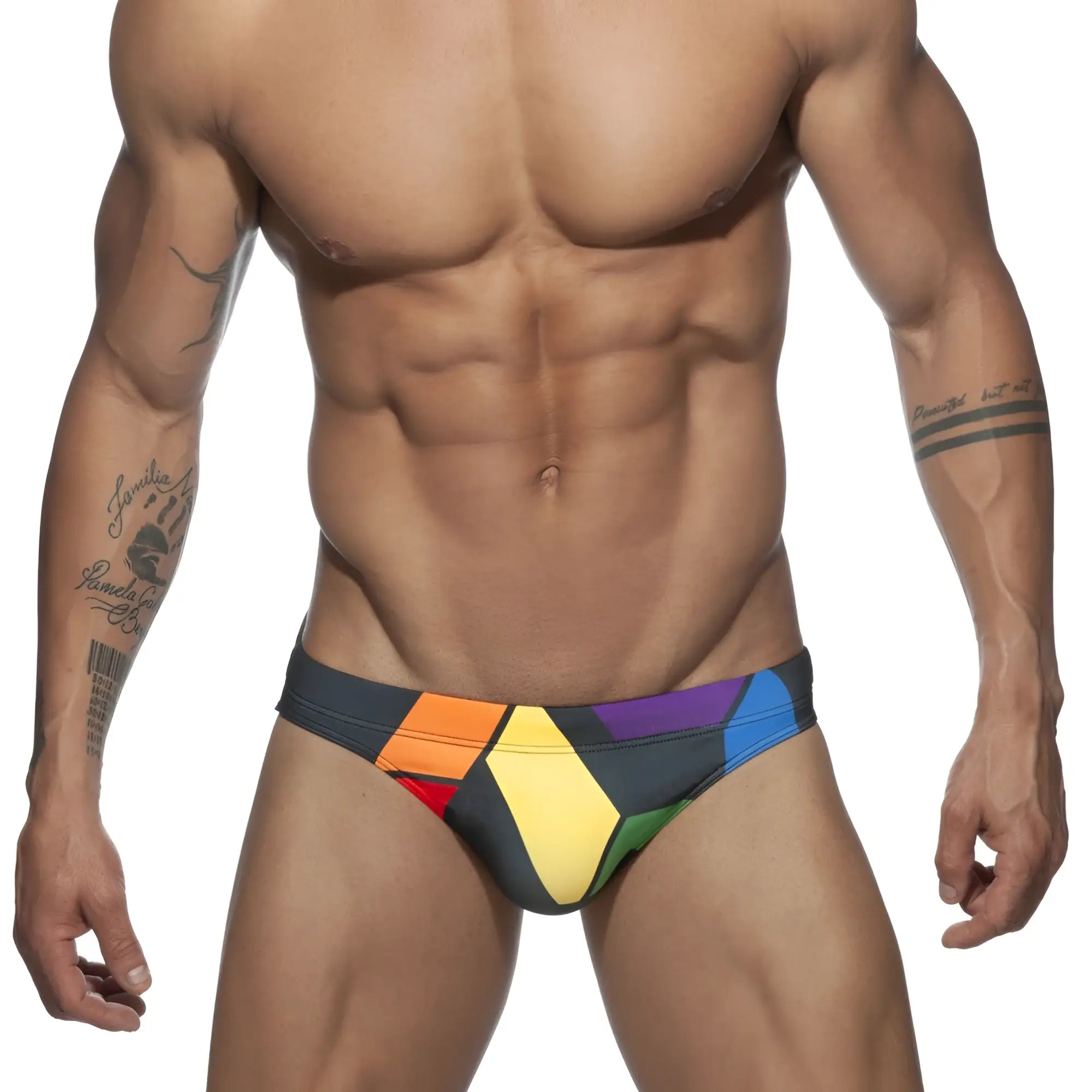 Vibrant geometric patterned ad pride bikini swim trunks in bold rainbow hues perfect for summer beachwear