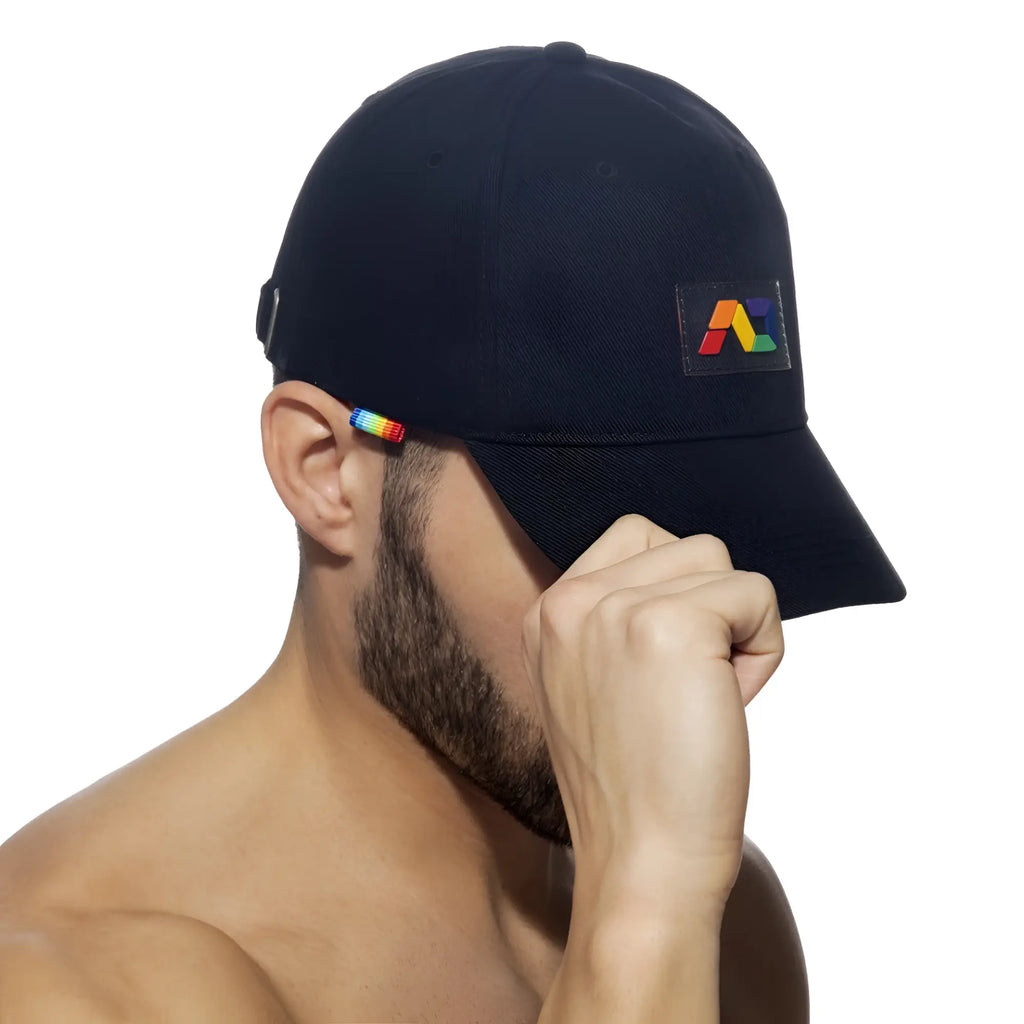 Black baseball cap ad rainbow cap with a rainbow-colored logo patch and matching rainbow stripe on ear flap