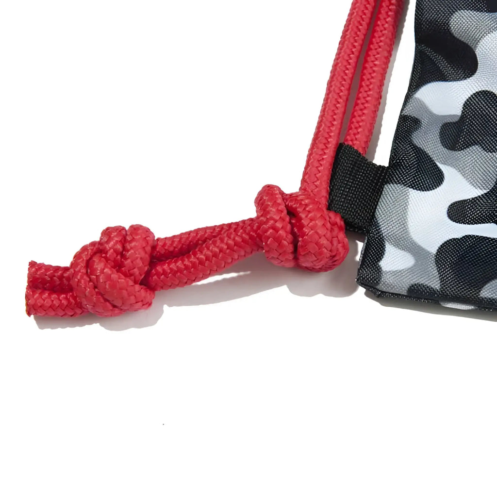 Red braided drawstring with knotted end on charcoal black gray camouflage addicted camo backpack bag size one size