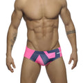 Bright pink and navy blue geometric patterned men’s swim trunks with Addicted logo on the side size medium