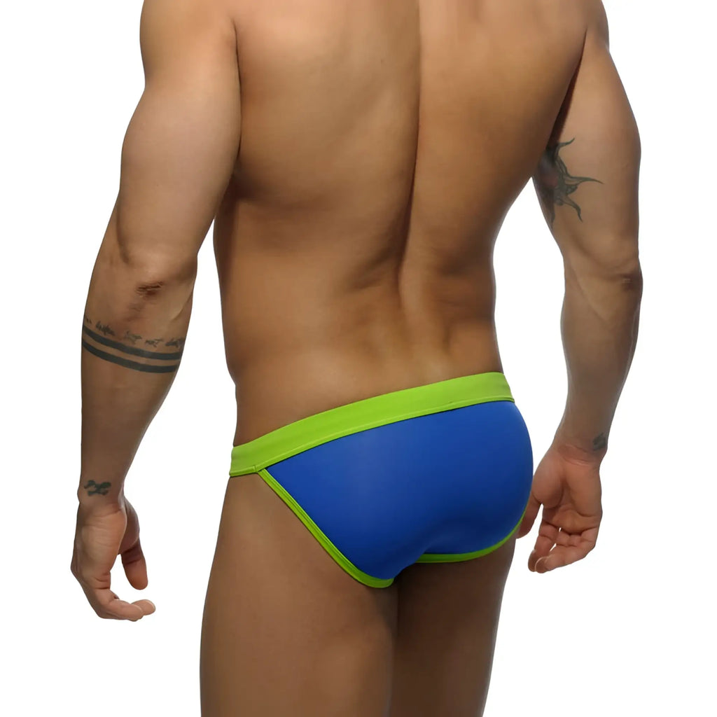 Blue and neon green snug form-fitting low rise bikini swimwear trunks by Addicted in royal blue size M