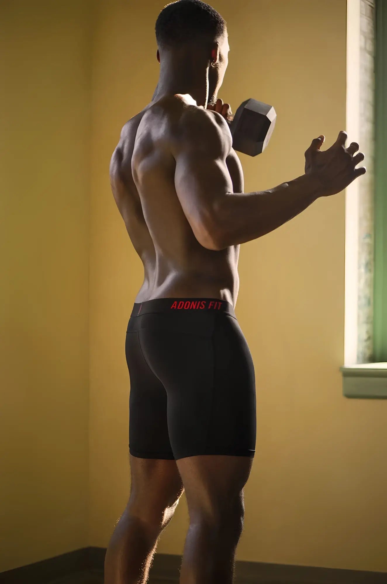 Black athletic boxer briefs with red adonis fit waistband branding designed for performance and comfort