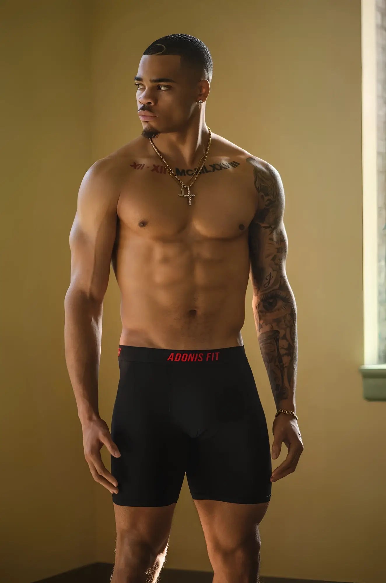 Black adonis fit performance boxer briefs with red branded waistband designed for comfort and active wear