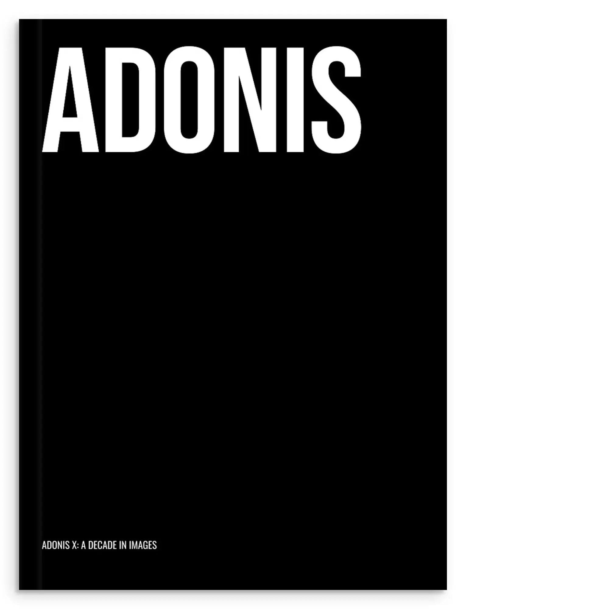 Black hardcover photobook adonis x a decade in images with bold white sans-serif typography on the cover