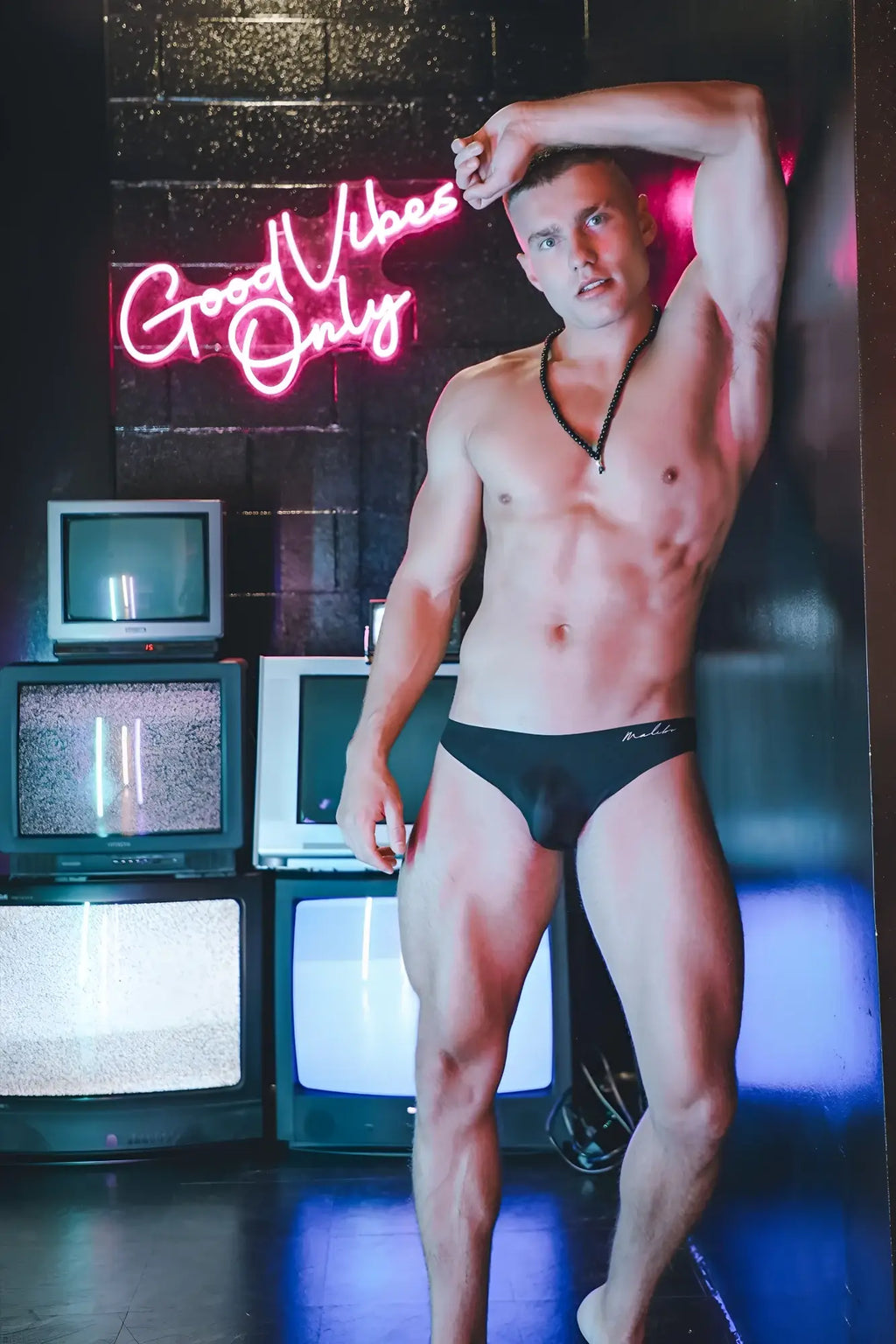 After-hours silky seamless black briefs with a small white logo on the left hip made from smooth fabric