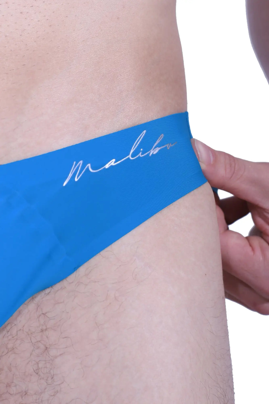 After-hours silky seamless briefs in neon blue with bright blue malibu swim trunks and white cursive logo waistband