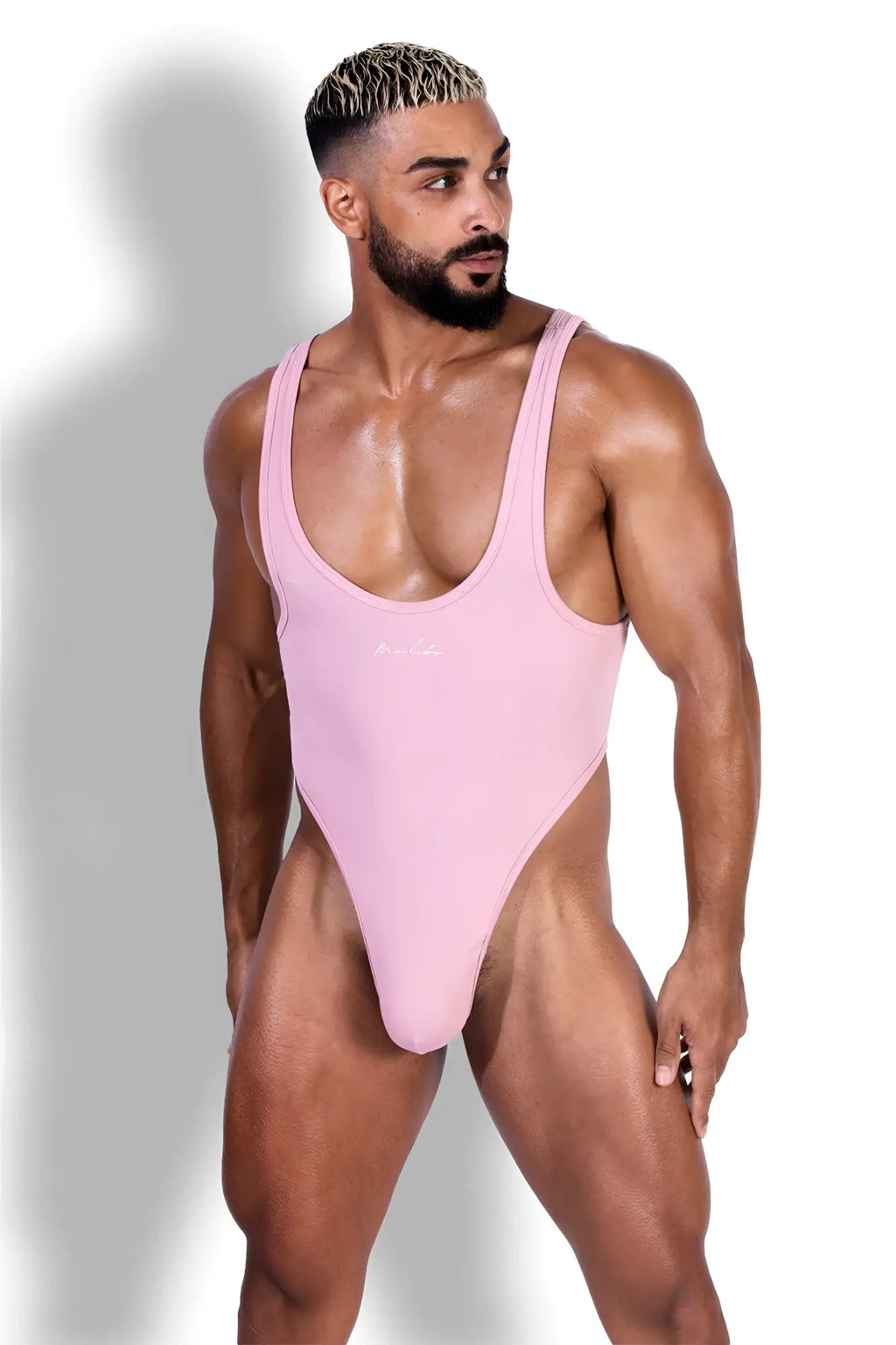 Afterglow ribbed bodysuit blush pink sleek form-fitting one-piece swimsuit with deep scoop neckline and high-cut legs