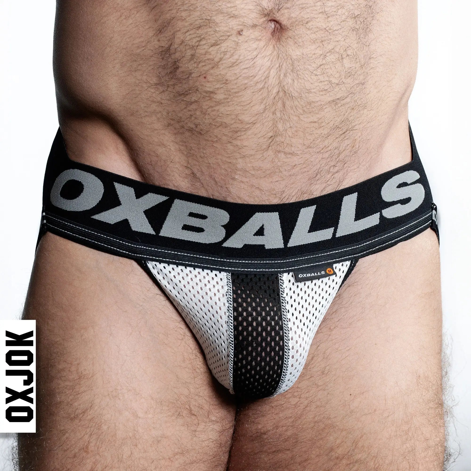 Black and white airmesh jockstrap briefs with bold oxballs logo on the waistband in breathable mesh material