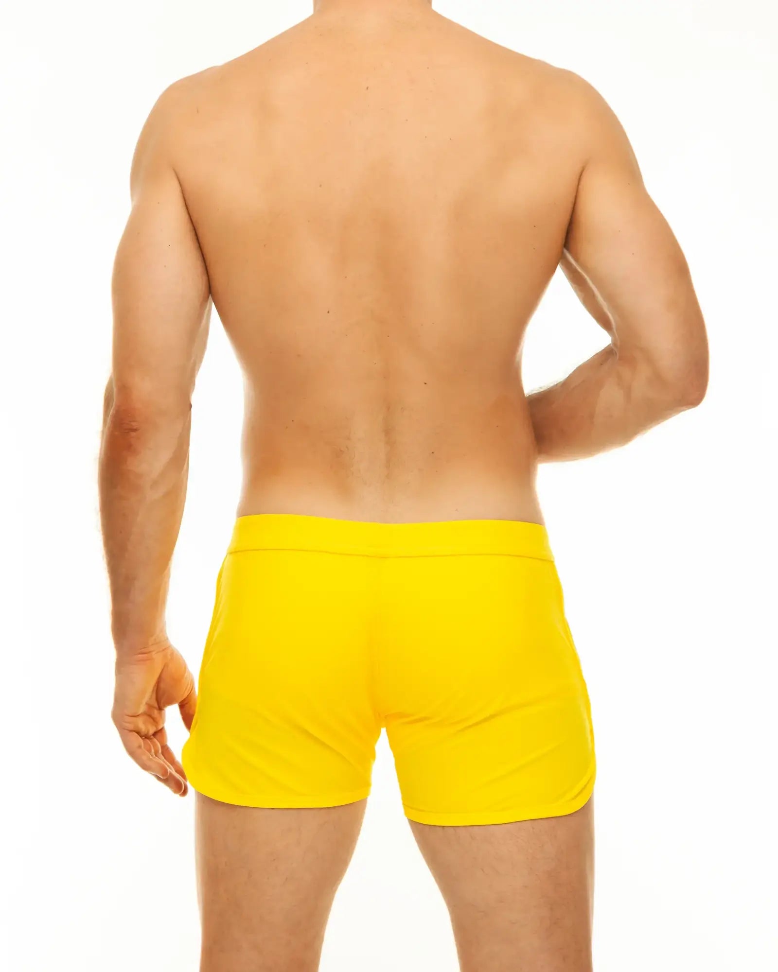 Bright yellow along slit swim short swim trunks with smooth fitted design for comfortable beachwear