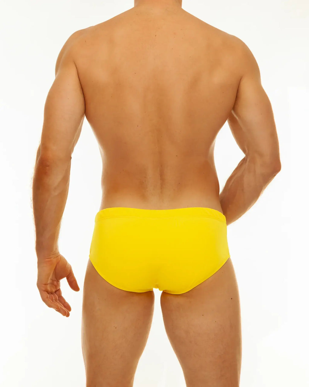 Bright yellow along solid swim brief made of swimwear material for comfortable beach or pool use
