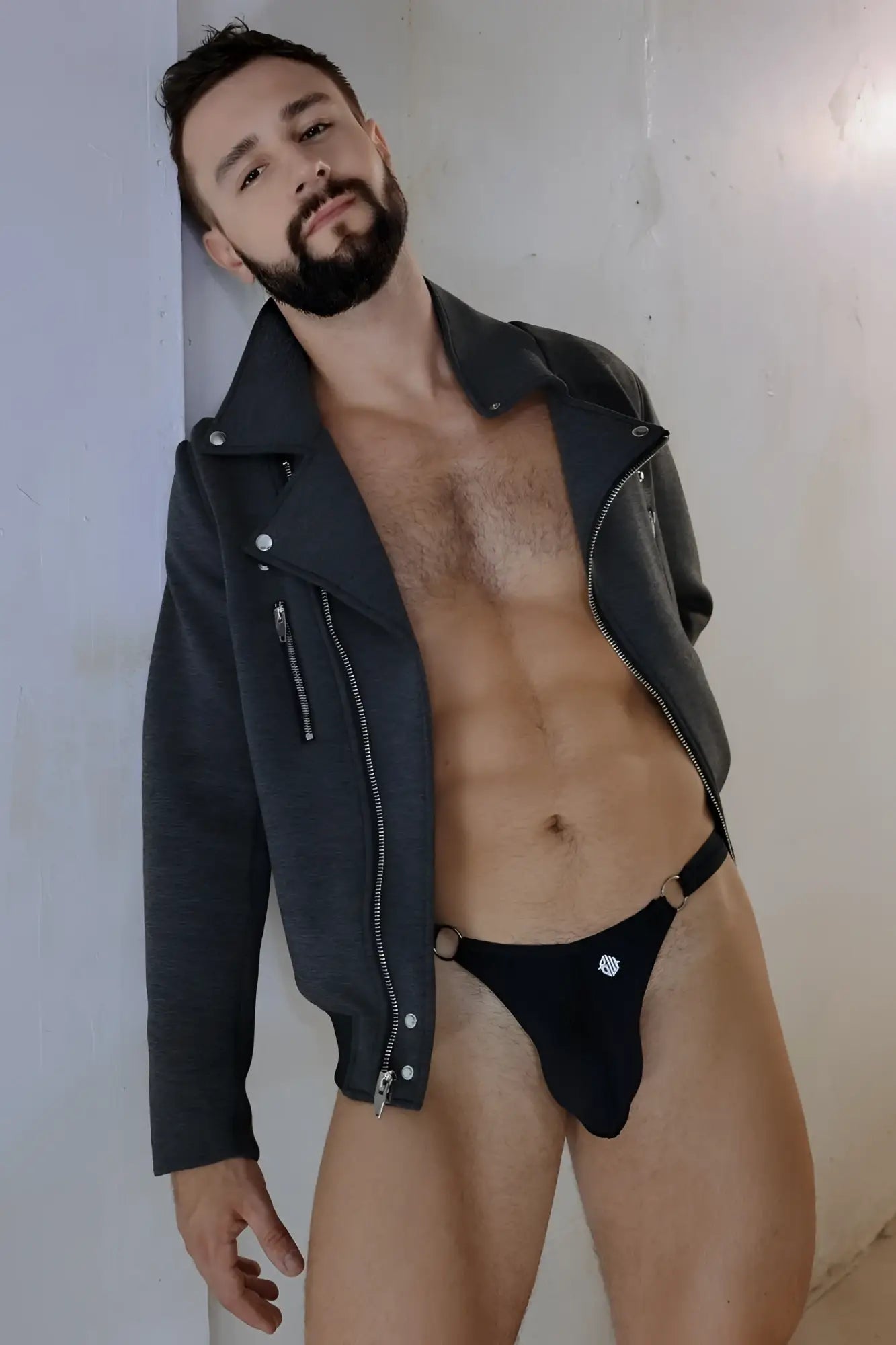 Black leather alpha biker jacket with silver zippers and snap buttons for motorcycle riding