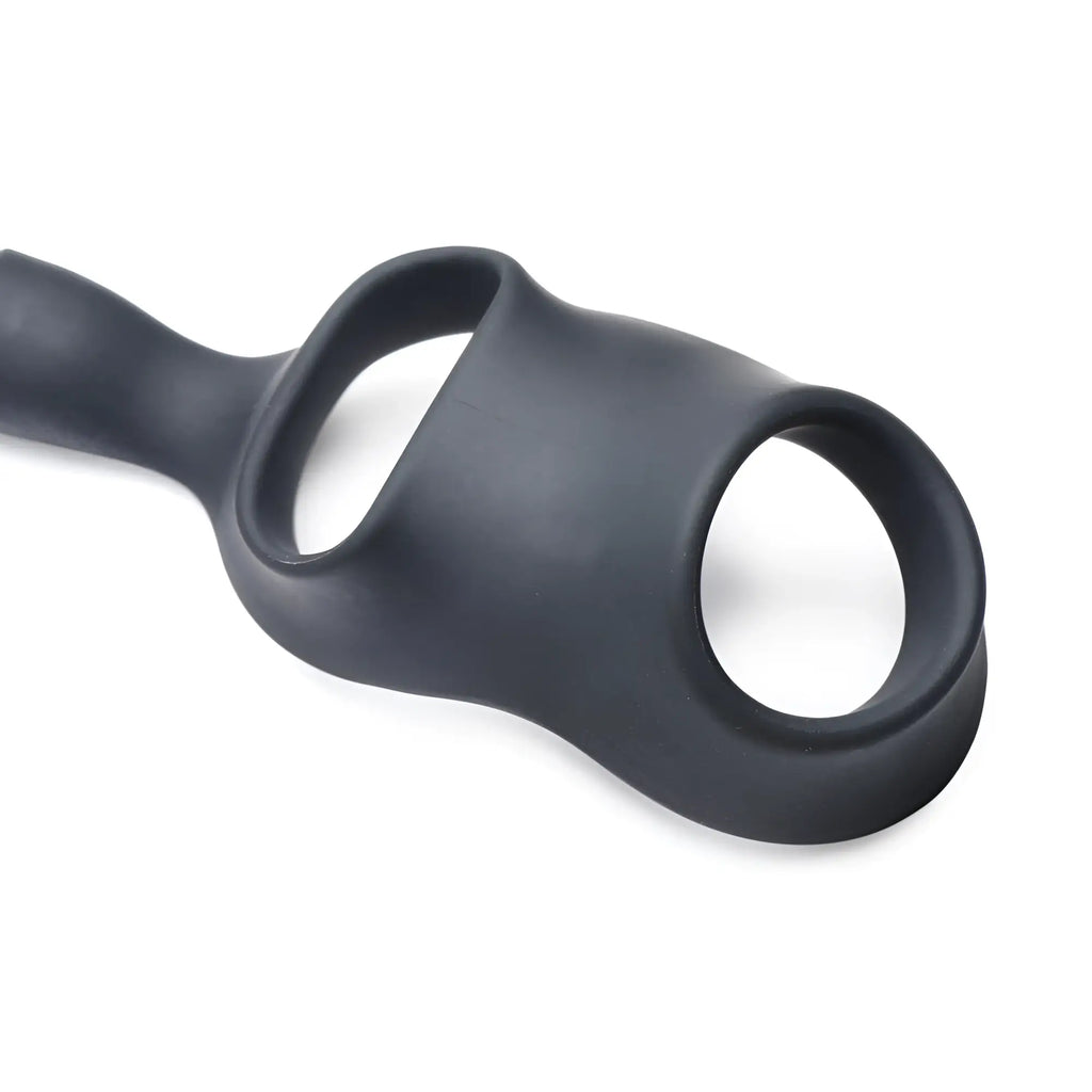 Alpha Pro 10X P-Bomb: matte black silicone dual-ring device with an integrated vibrating anal plug.