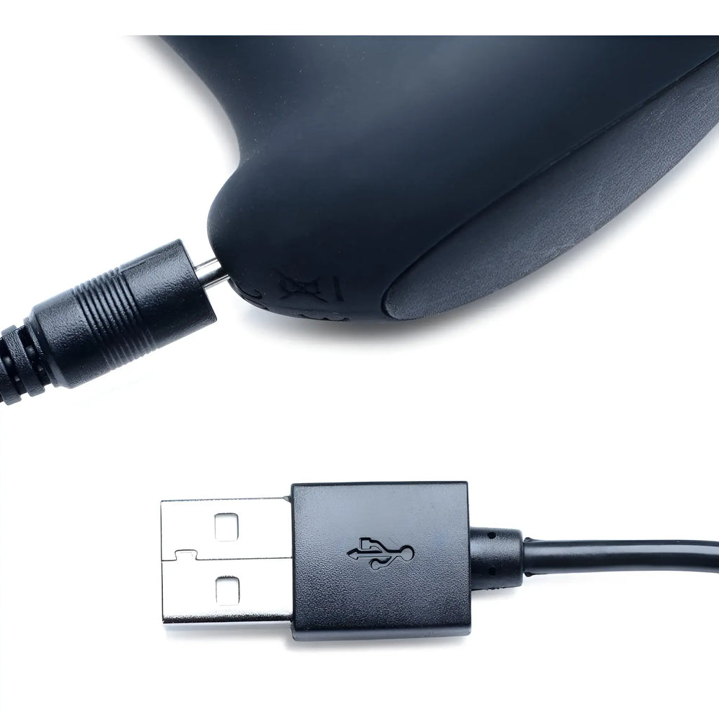 Alpha Pro 7X P-Milker silicone prostate stimulator charging cable with magnetic connector and black USB plug.