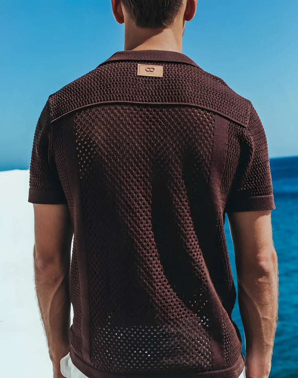 Amafi knit shirt brown textured knit polo with subtle woven pattern and small leather brand tag at collar