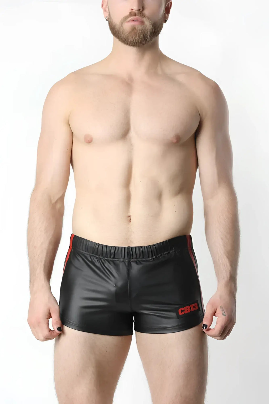 Black shiny faux leather anti-chrome gear shorts with red side stripes and small embroidered logo on left leg