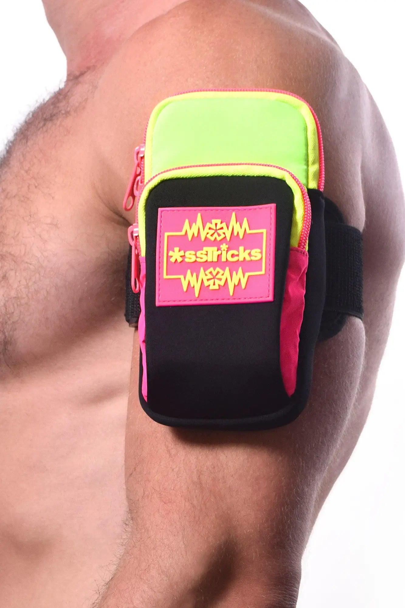 Neon green and black arm bag with pink zipper accents and bold sstricks logo patch designed for easy carrying