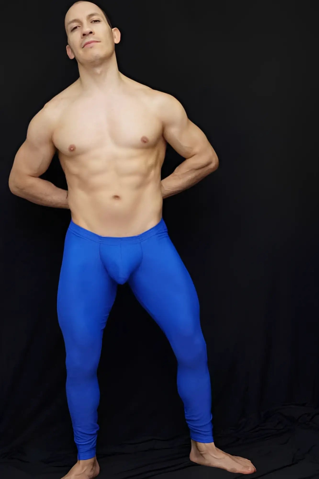 Bright blue form-fitting arroyman bulge runner pants athletic leggings in size medium designed for running