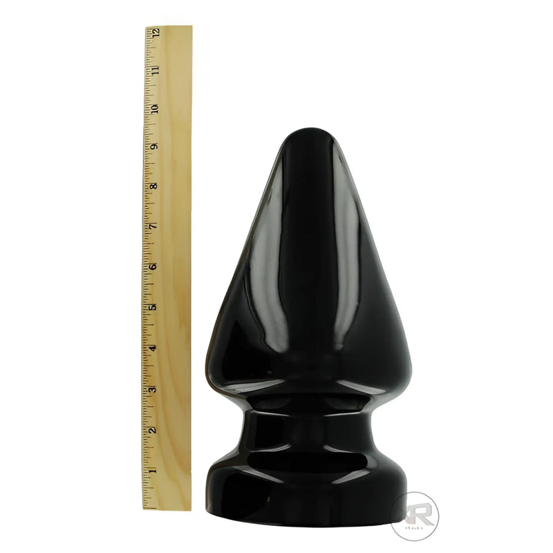 Black glossy plastic butt plug the ass stopper xxl with tapered pointed tip and rounded base