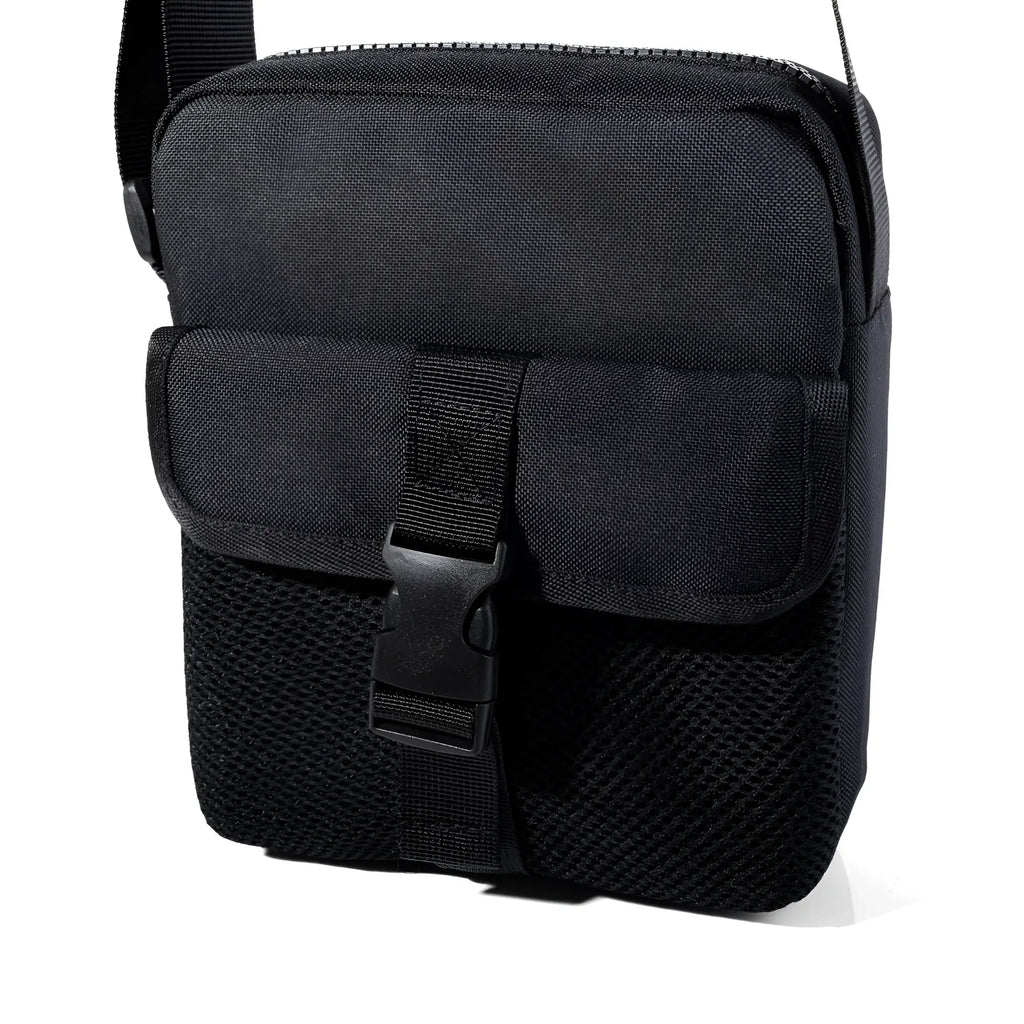 Black athletic crossbody bag with tactical style mesh panels and secure buckle closure for versatile use
