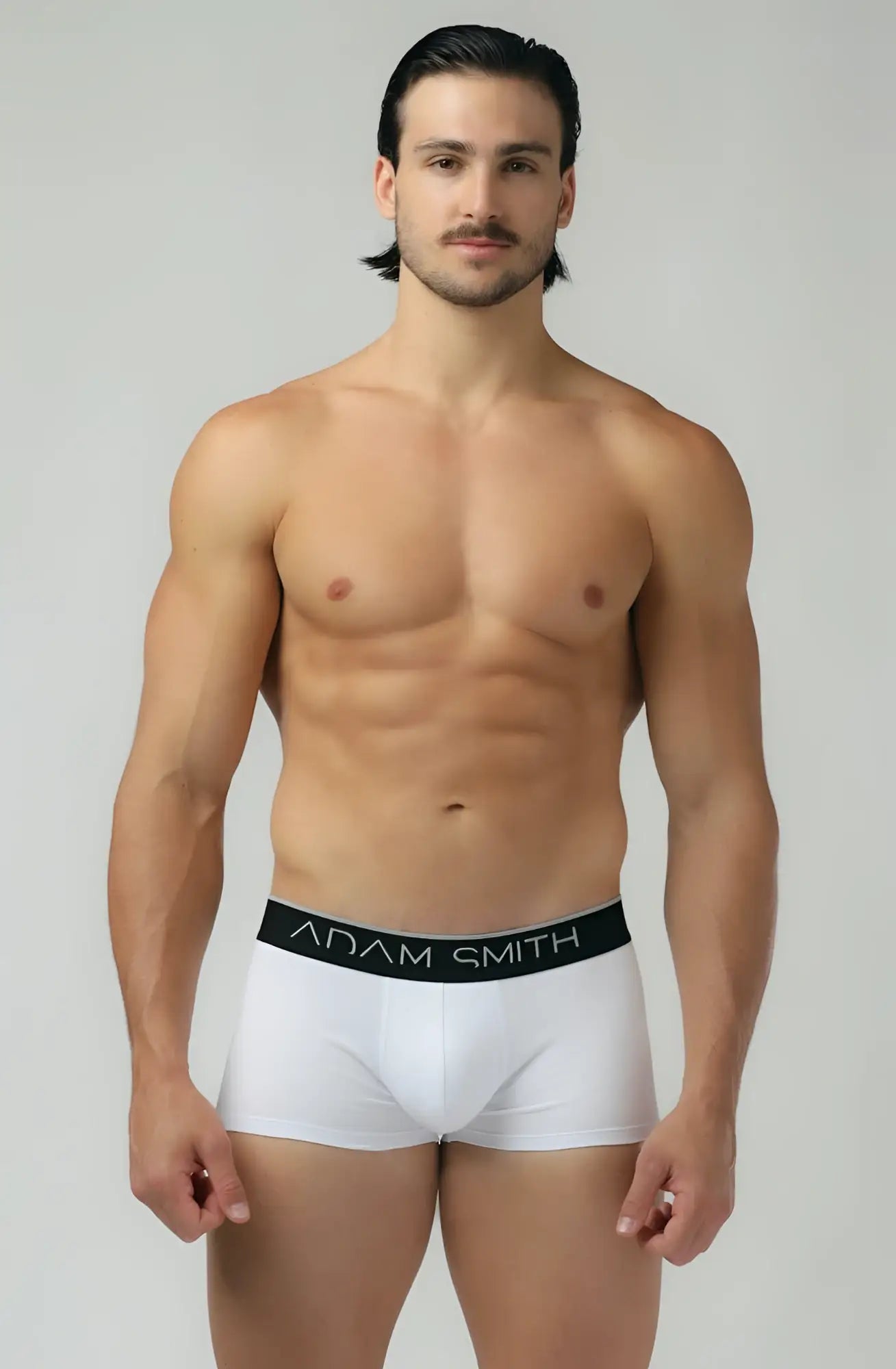 White adam smith briefs with a black waistband featuring the brand name in white lettering from b-shorts