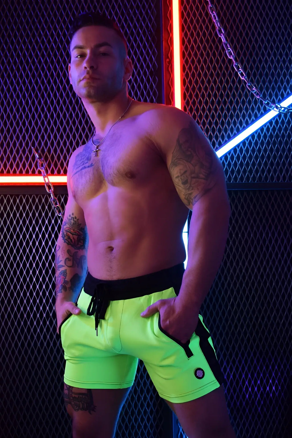 Neon green backpack shorts with black side panels and matching drawstring waistband for athletic use