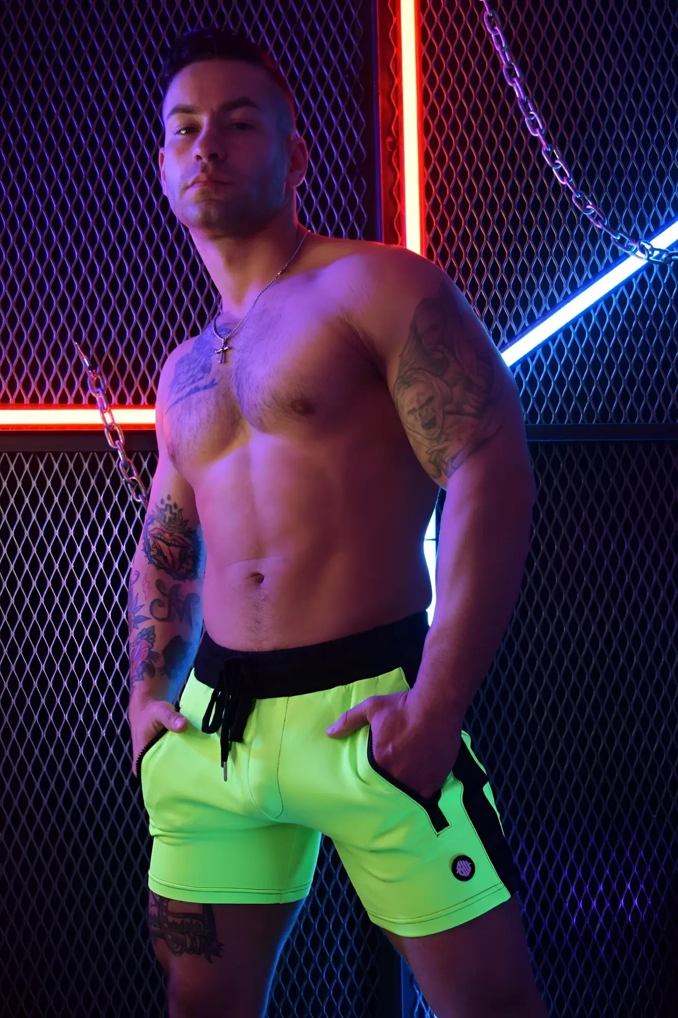 Neon green backpack shorts with black side panels and matching drawstring waistband for athletic use