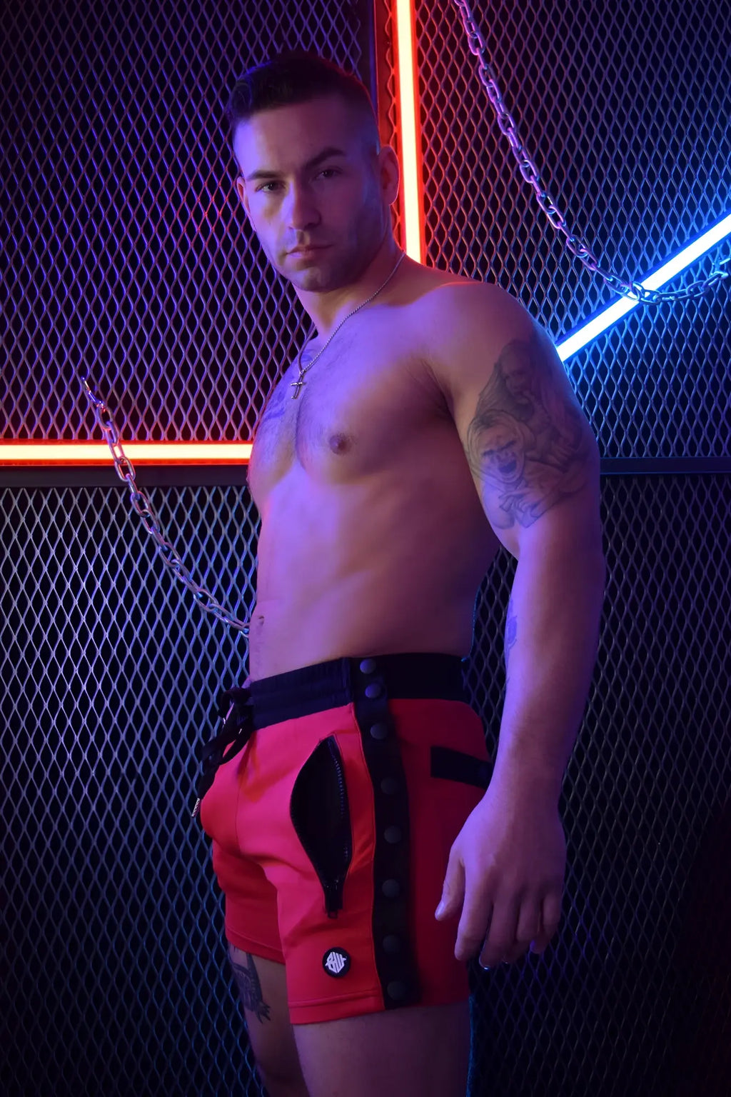 Red backpack shorts with black trim and zipper details for casual and active wear