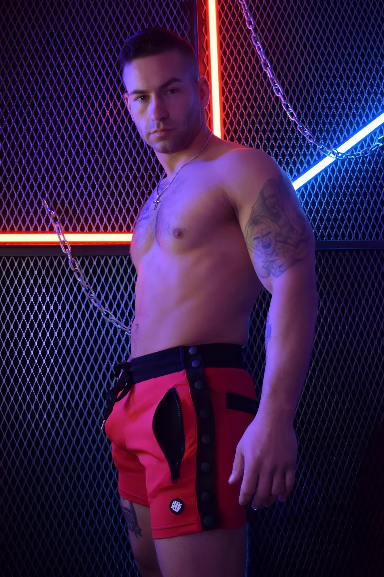 Red backpack shorts with black trim and zipper details for casual and active wear