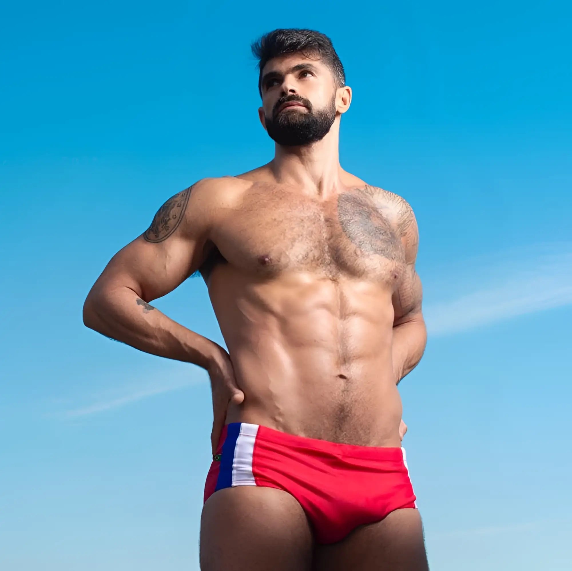 Red swim trunks Bahia Trio Sunga in classic cut with white and blue side stripes designed as designer swim shorts