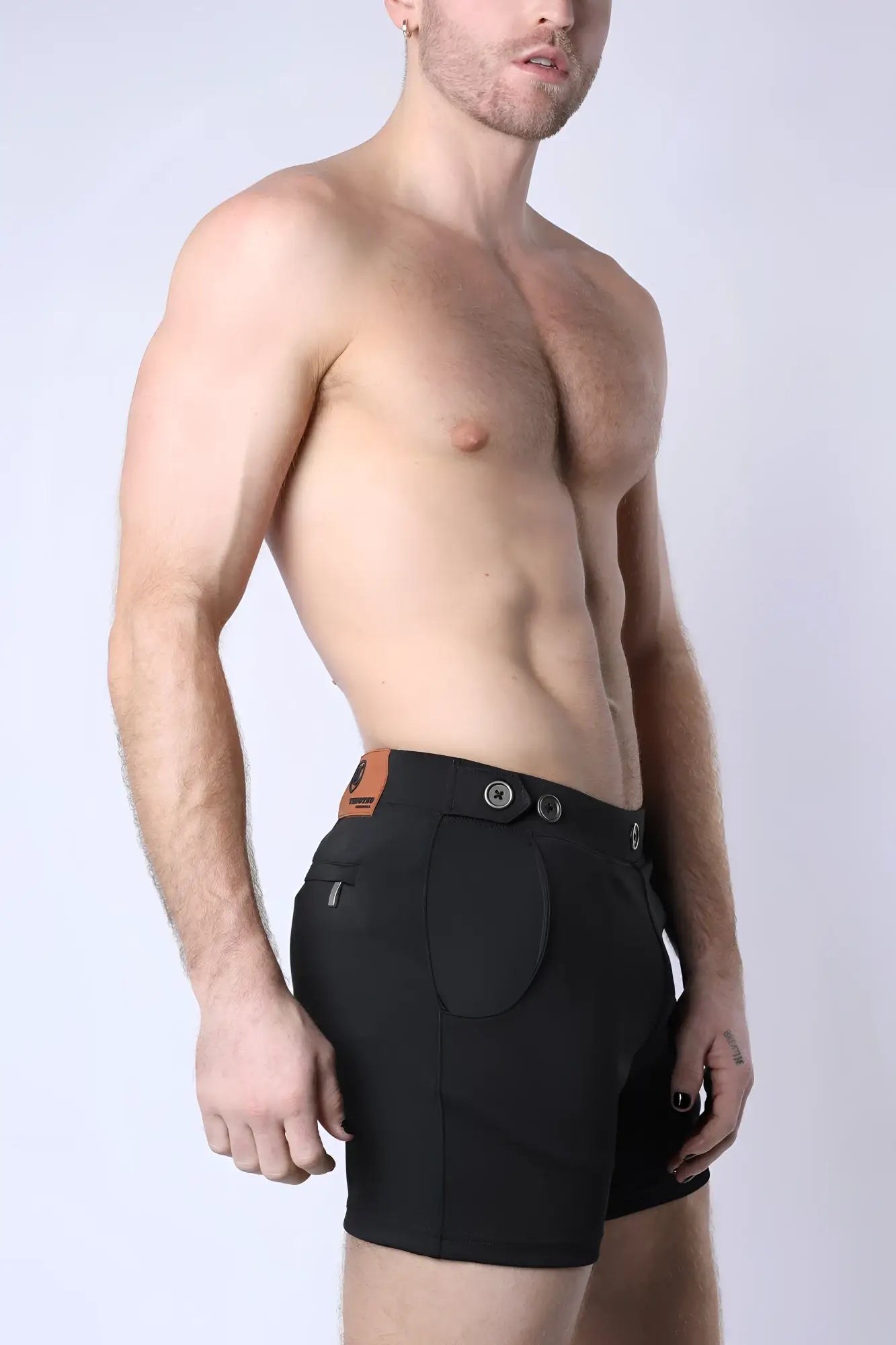 Black balboa hybrid swim short with sleek tailored design and contrasting brown leather belt loop