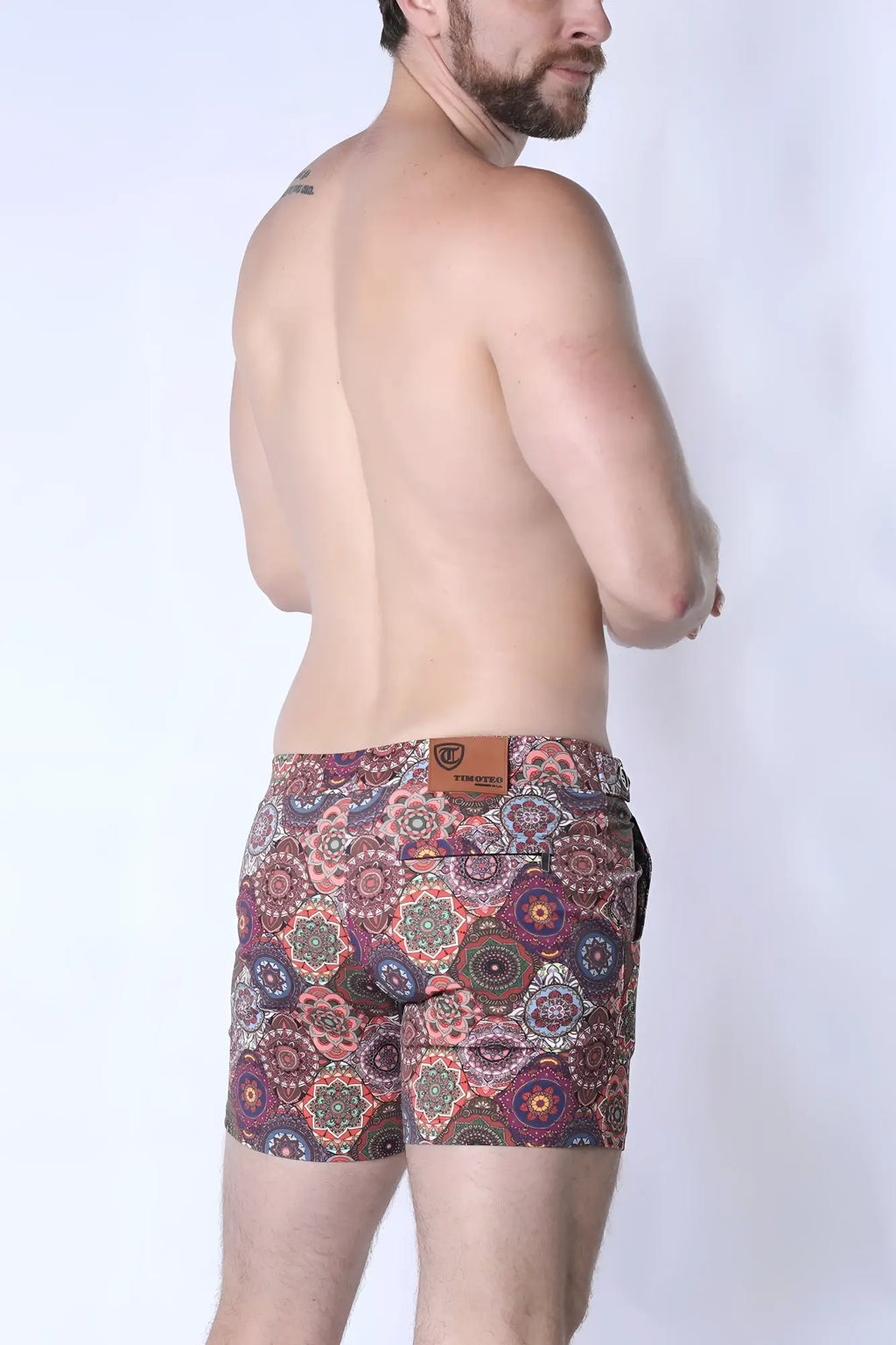 Men’s balboa hybrid swim short with vibrant pink purple and green mandala pattern on cotton blend fabric front view