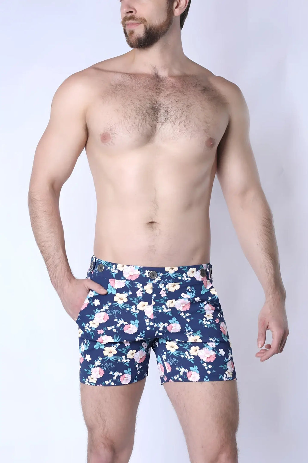 Navy blue balboa hybrid swim shorts with vibrant pink white and light green floral pattern for casual beachwear