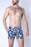 Navy blue balboa hybrid swim shorts with vibrant pink white and light green floral pattern for casual beachwear