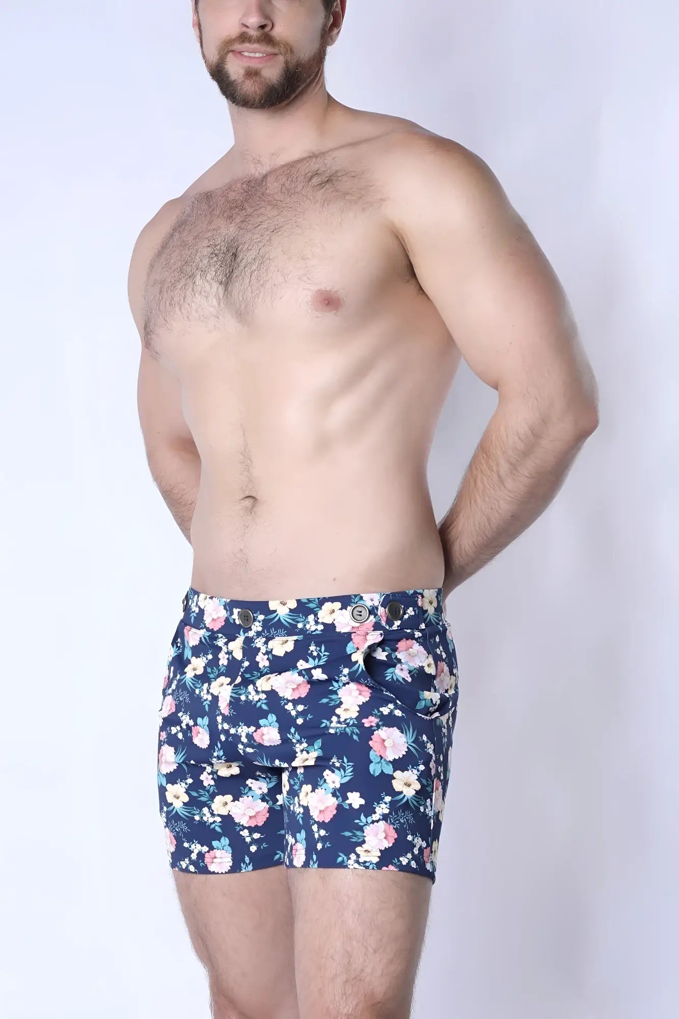 Navy blue balboa hybrid swim short featuring vibrant pink white and light green floral pattern for beachwear