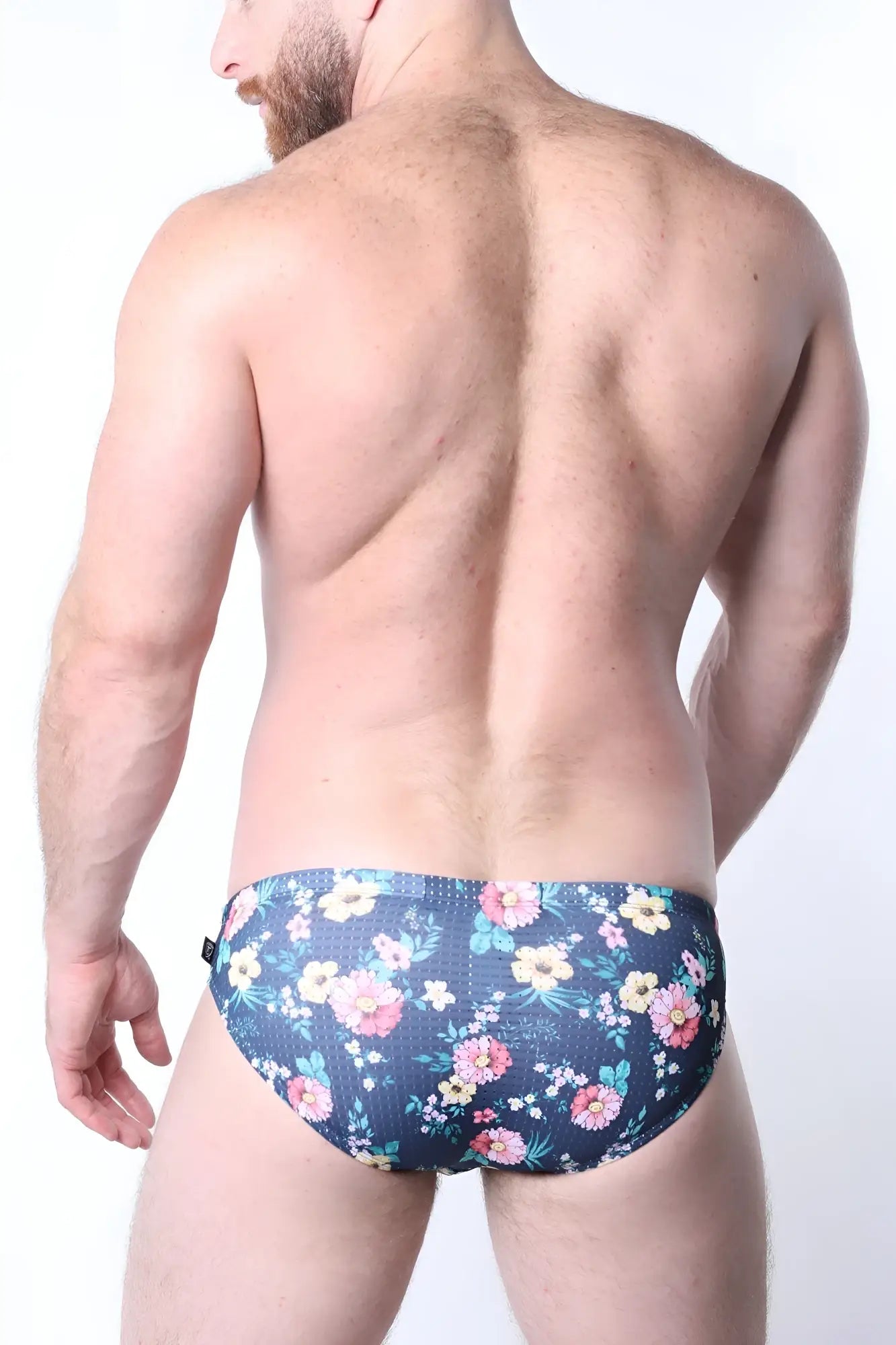 Balboa low rise swim brief dark blue floral patterned men’s briefs with pink yellow and white flowers