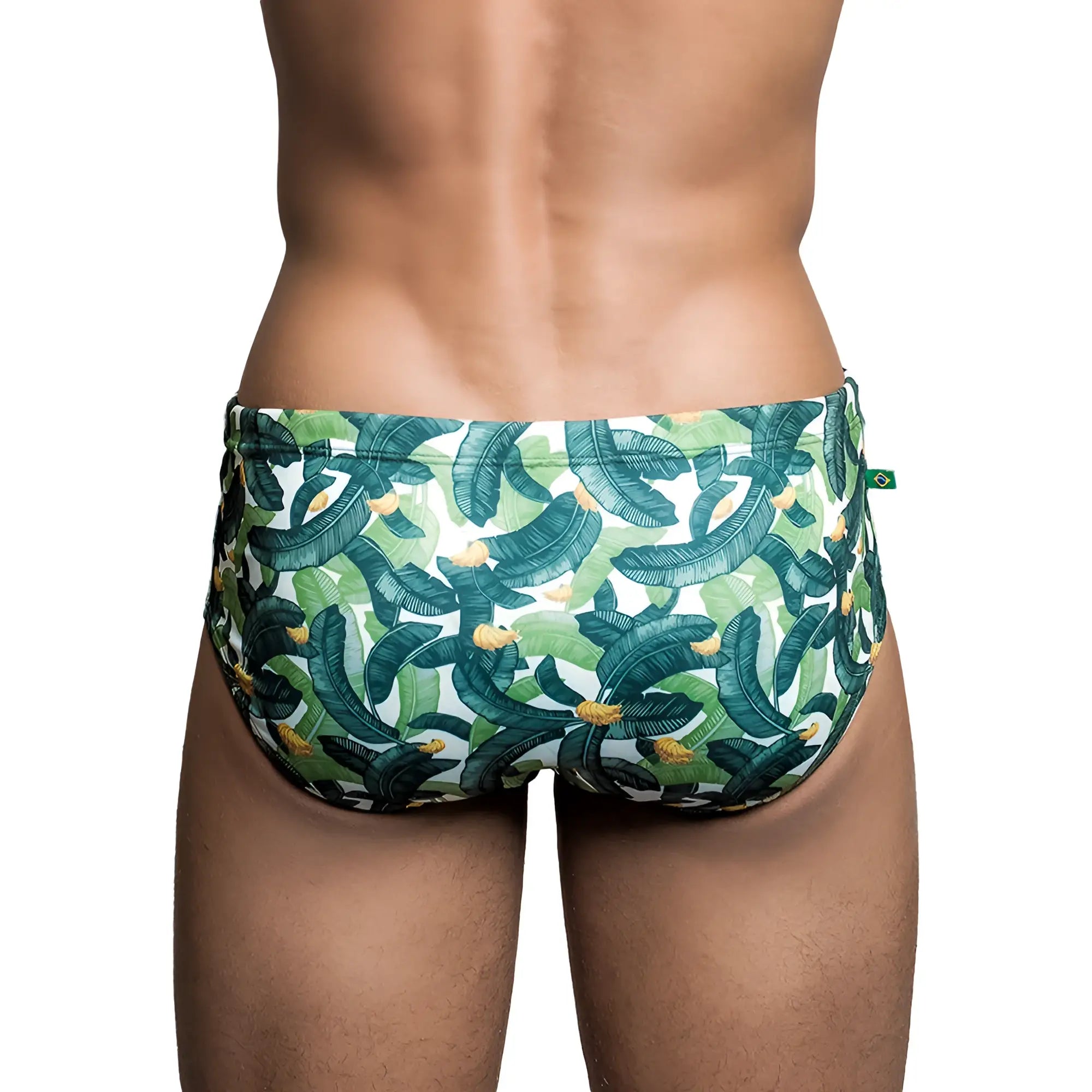 Bananada Sunga men’s designer swimwear featuring green and white banana leaf patterned swim trunks with yellow accents