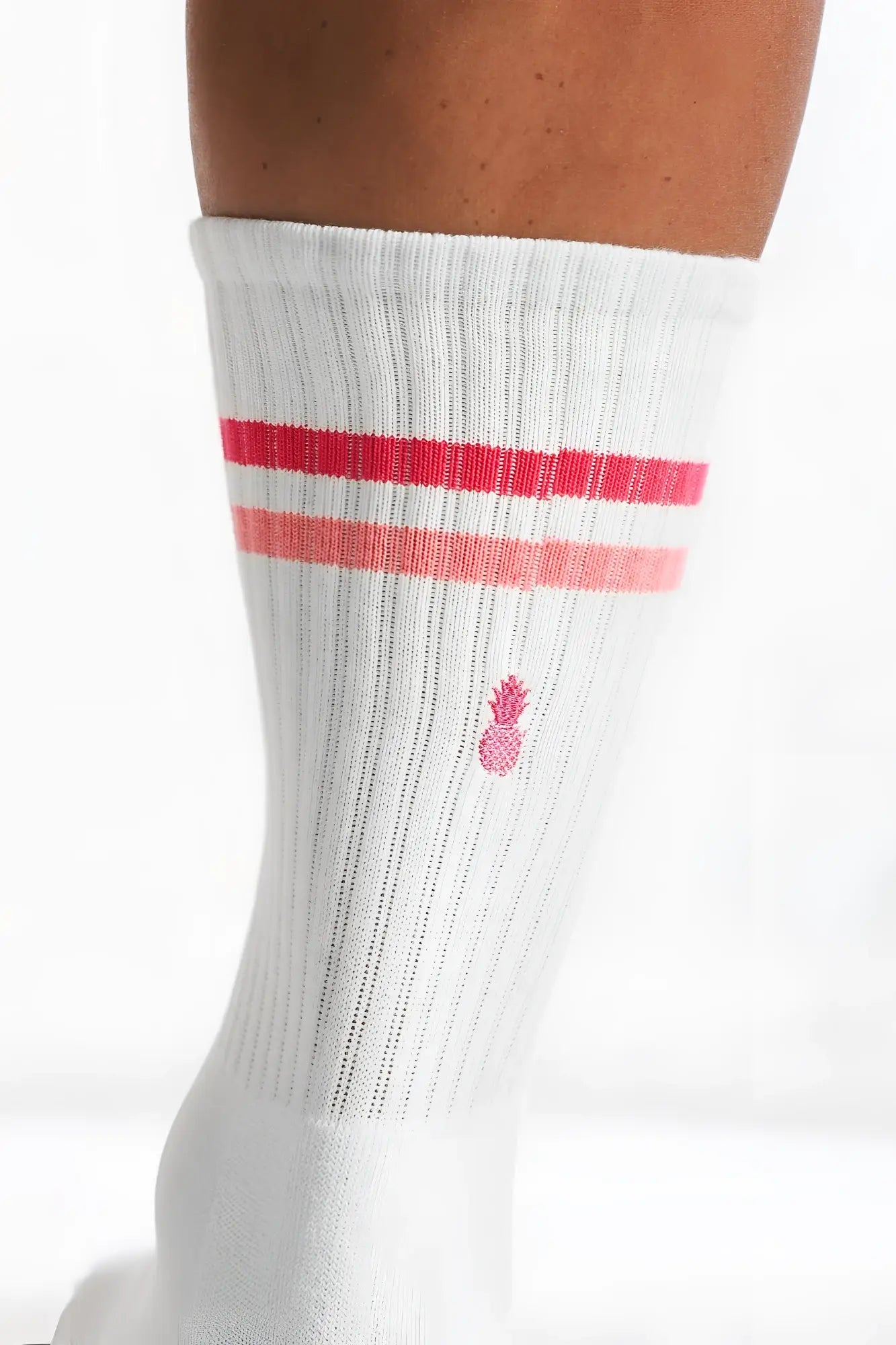 White ribbed banded high socks with two pink stripes and a small embroidered pineapple logo strawberry stripes