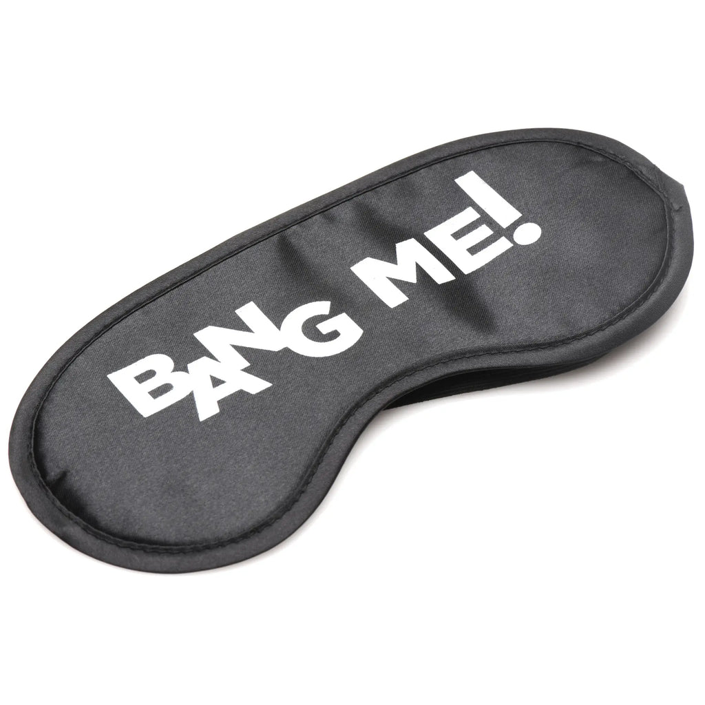 Black satin sleep mask with bold white bang me text from the bang bondage kit for intimate play