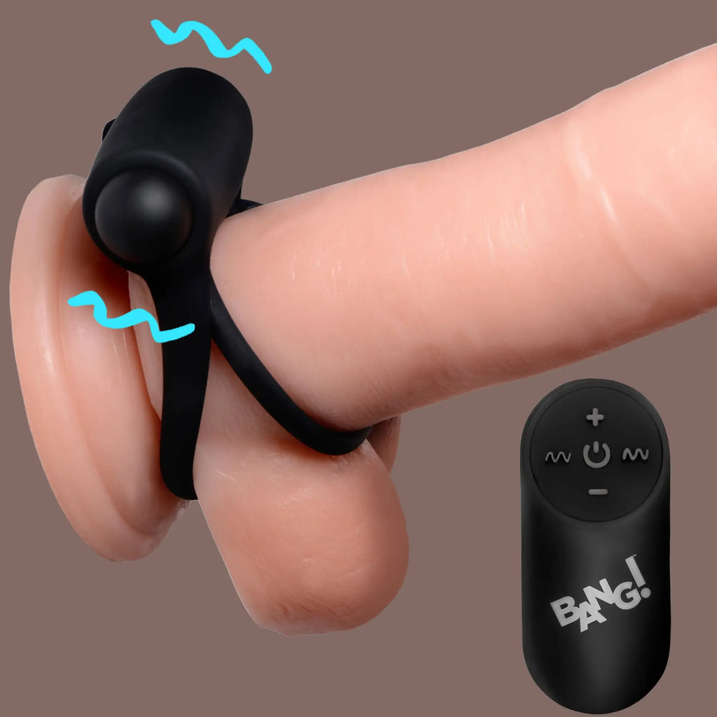 Bang 28X black vibrating cock ring and bullet on a model, shown with its matching remote control.