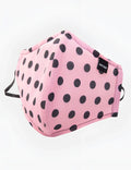 Pink polka-dot fabric face mask with black dots and adjustable elastic ear loops by barcode berlin unisex one size