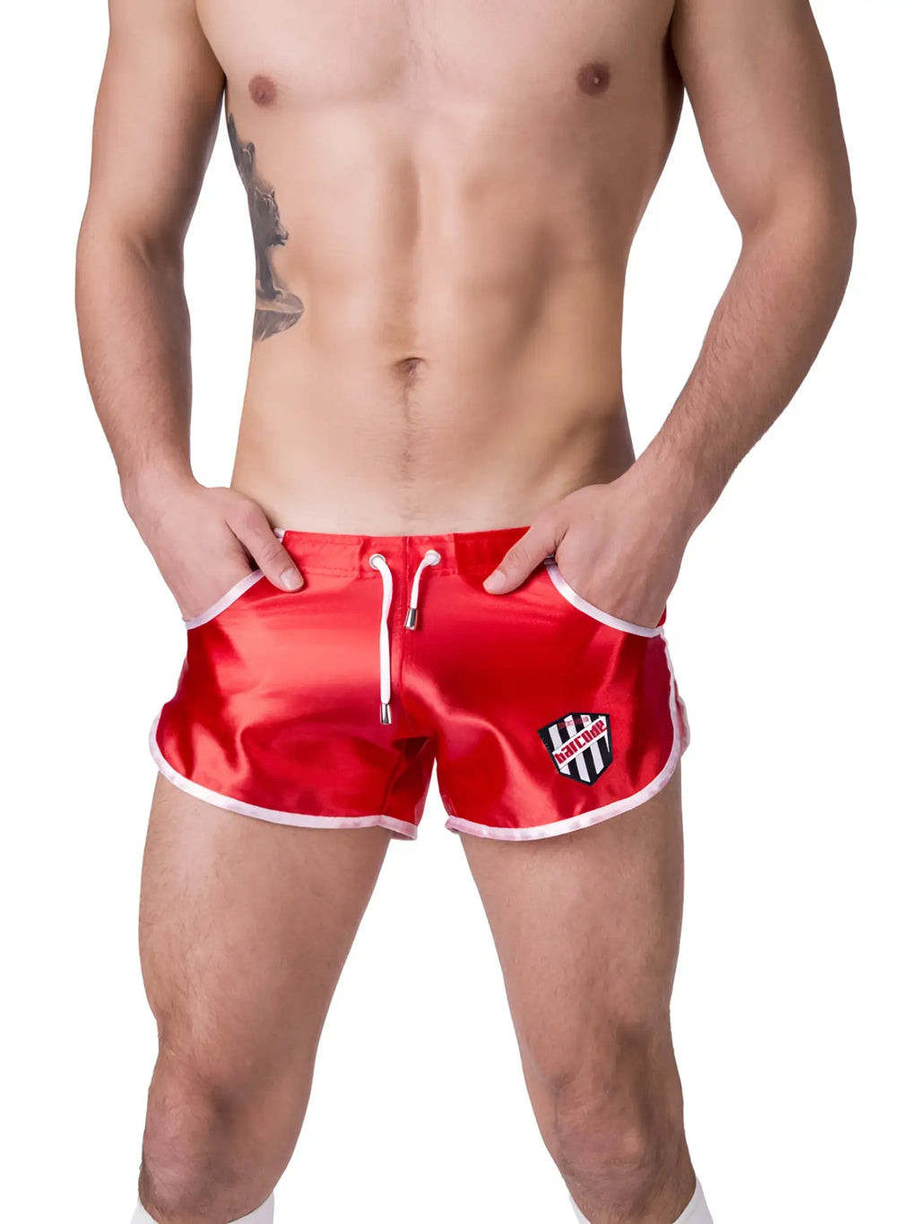 Red satin swim trunks with white trim and a black and white shield logo on the left leg by barcode berlin size xl