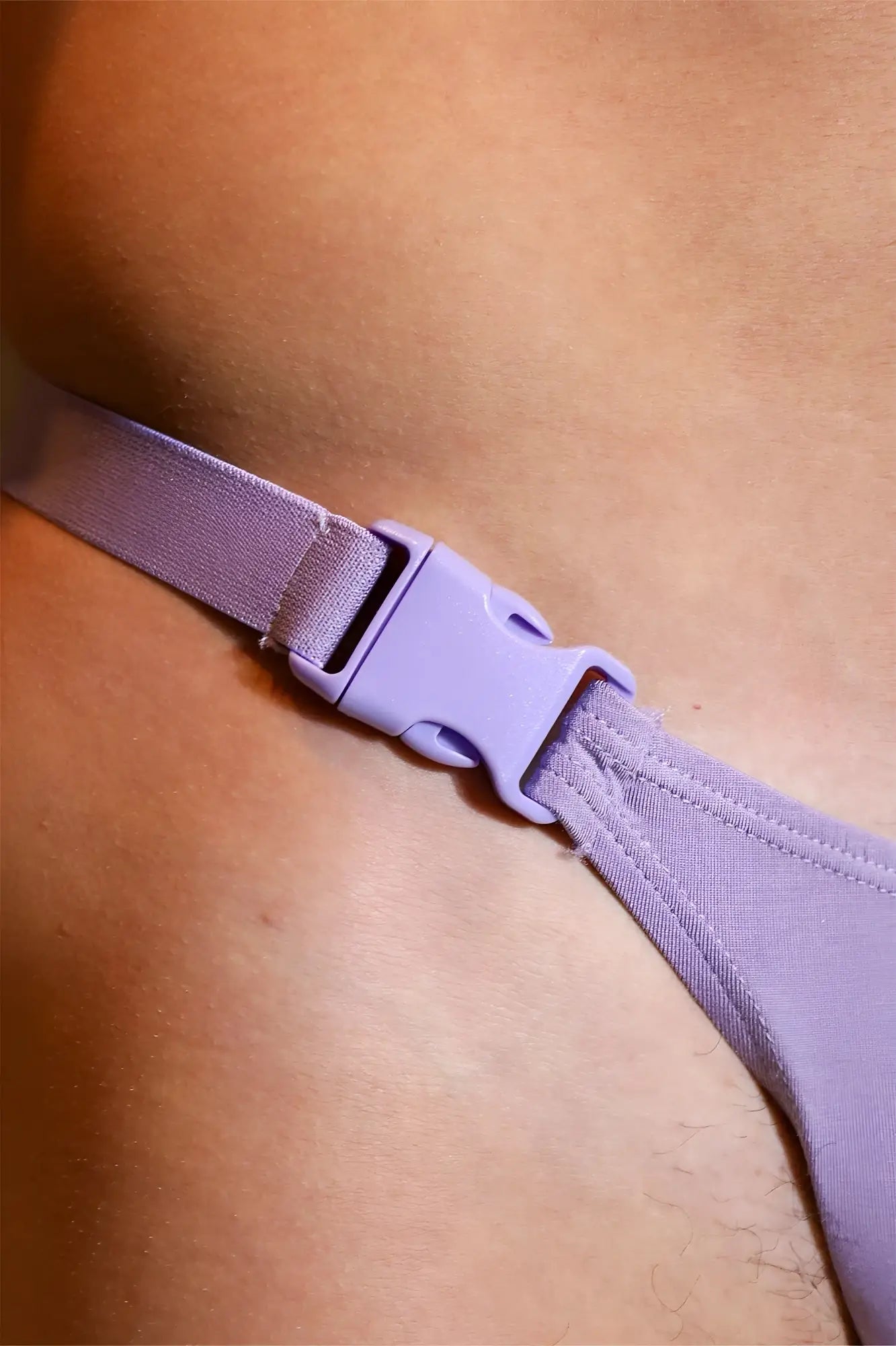 Barely there modal thong purple with a lavender elastic strap and matching plastic buckle shown from the back