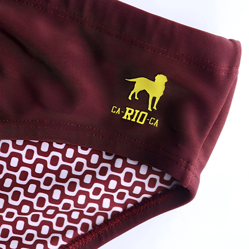 Barolo burgundy solids men’s swimming sunga with yellow embroidered dog logo and white geometric inner lining for beachwear