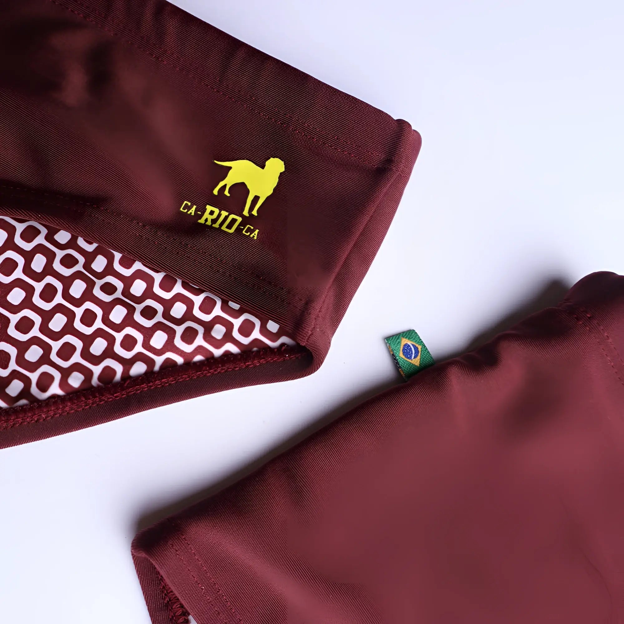 Barolo burgundy solids men’s swimming sunga with yellow dog logo and white geometric inner lining for beachwear