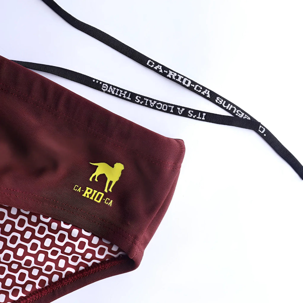 Barolo burgundy solids men’s swimming sunga with maroon bottom yellow dog logo ca rio ca text and white geometric lining