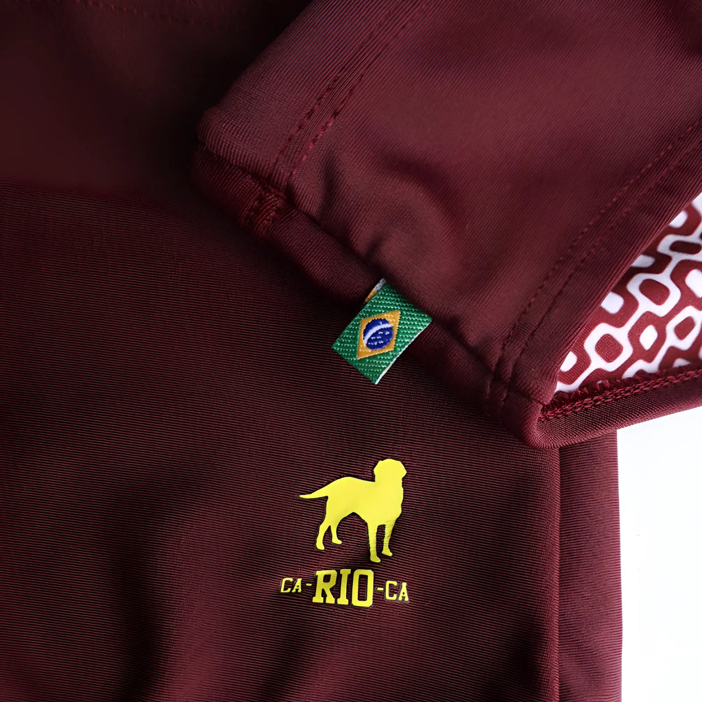 Barolo burgundy solids men’s swimming sunga featuring yellow embroidered dog and ca-rio-ca text with brazilian flag tag